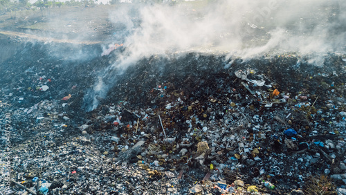 Quadro su tela Burning landfill with smoke and waste environmental pollution