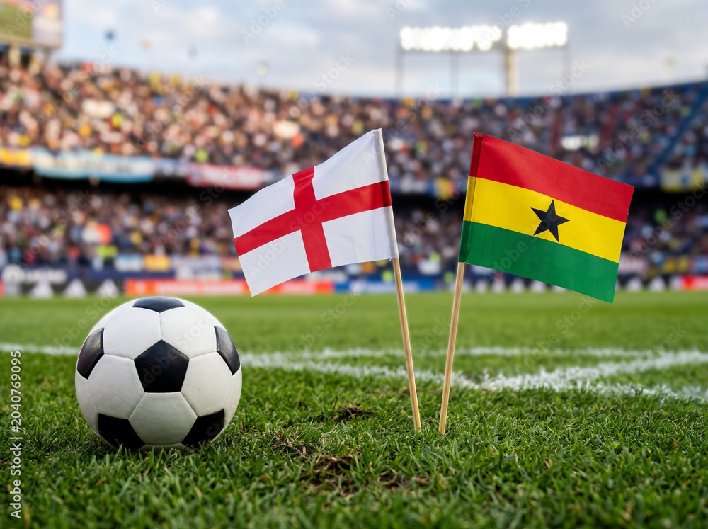 Naklejka premium England and Ghana flags with football on green field