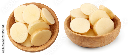 sliced raw potato in wooden bowl isolated on white background. clipping path