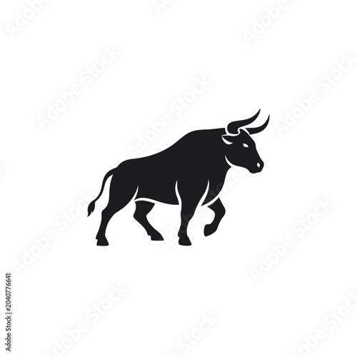 Powerful black bull silhouette in walking pose
