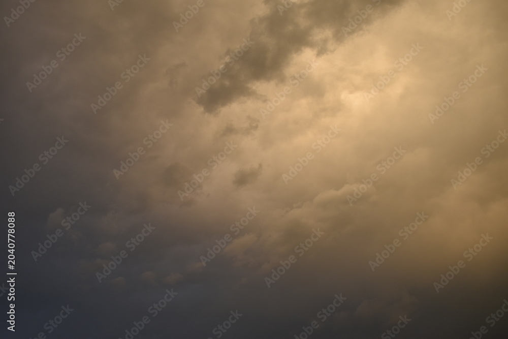 Fototapeta premium Sunset sky covered with dark clouds