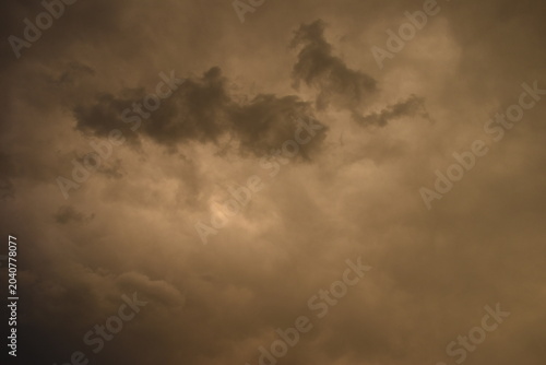 Sunset sky covered with dark clouds
