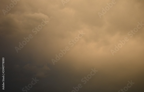 Sunset sky covered with dark clouds