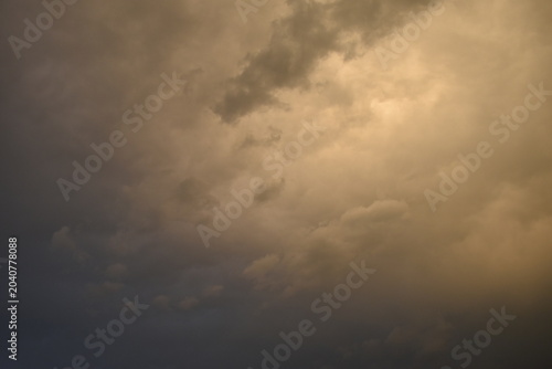 Sunset sky covered with dark clouds