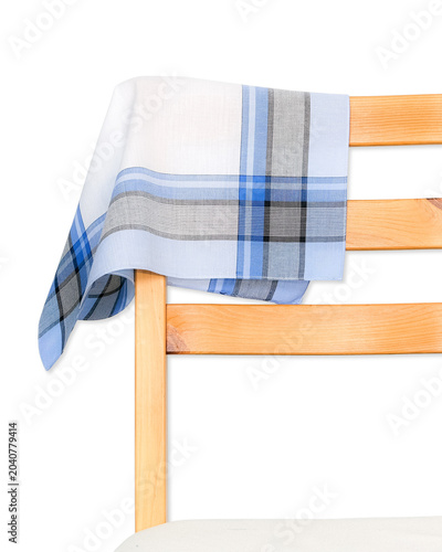 A classic blue, gray, and white plaid cotton handkerchief draped over the back of a wooden chair isolated on a white background.