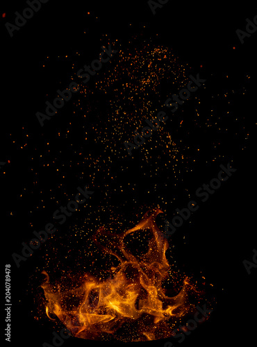Vivid flames erupt from dark background