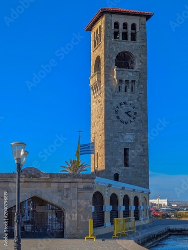 Historic church tower by the harbor in the city of Rhodes