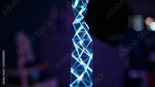 Cyan geometric helix structure symbolizing complex digital data network