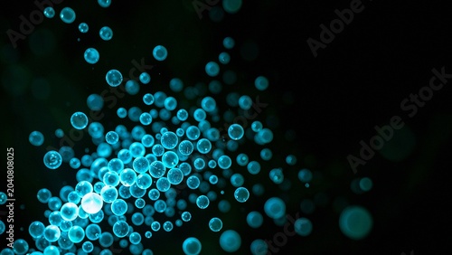 Isolated cluster of translucent blue spheres radiating energy in deep black space