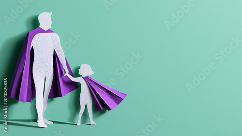 Father and daughter silhouette wearing superhero capes. Paper art concept of hero dad holding child hand. Greeting card illustration for Fathers Day celebration with copy space.