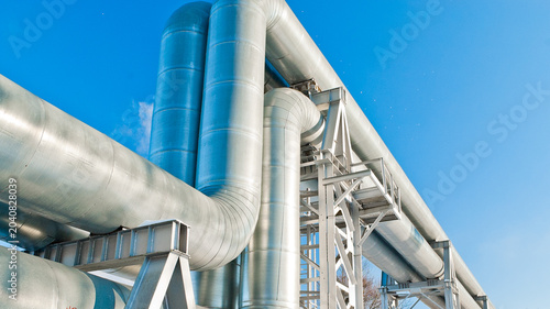 close-up of a pipeline against a blue sky