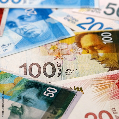 Foto Israel shekel money bills pile on table