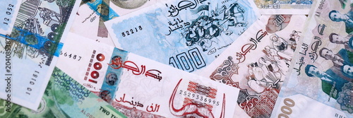 Canvas-taulu Algerian dinar money bills pile on table