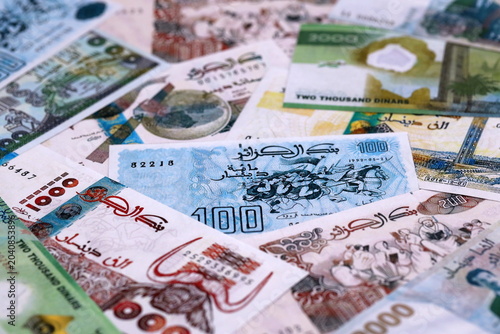 Photography Algerian dinar money bills pile on table
