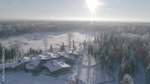 Drone rotating over snow covered resort
