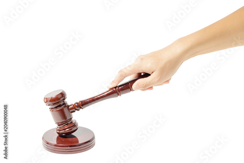 Schilderij op canvas Hand holding a wooden gavel in White Background