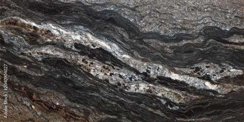 Dark, veined stone with streaks of white, tan, and grey creating a dramatic effect