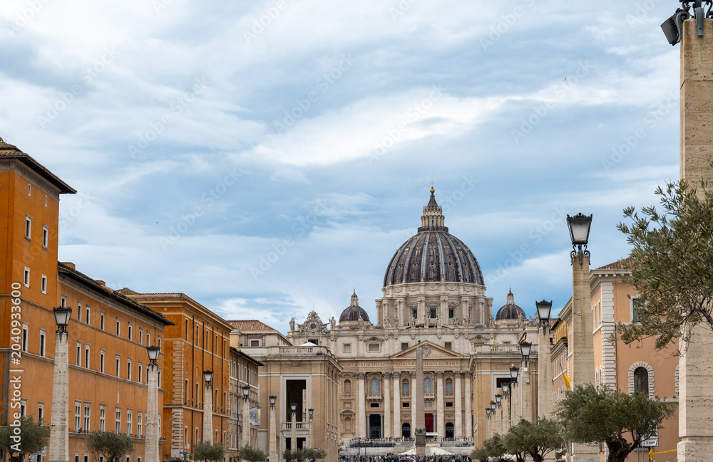 Fototapeta premium Walking in Rome and view on St. Peters Basilica, travel destination in Italy, Vatican City State, popes residence, sacred place, guided tour Rome, visit of Basilica and Dome