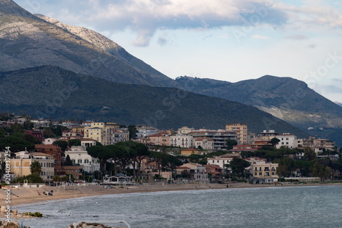 Fotografie Green gardens with palm and citrus trees on seaside shore between Gaeta and Form