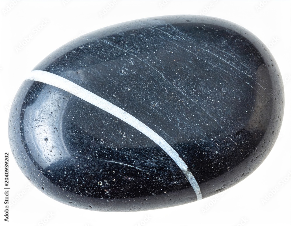 Naklejka premium Smooth, dark polished stone with a striking white stripe