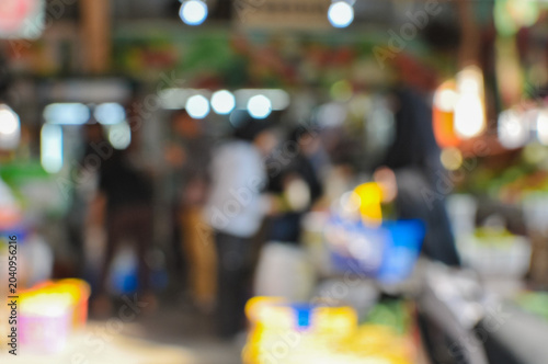 blurred image of a shopping cart at the local market, abstract background