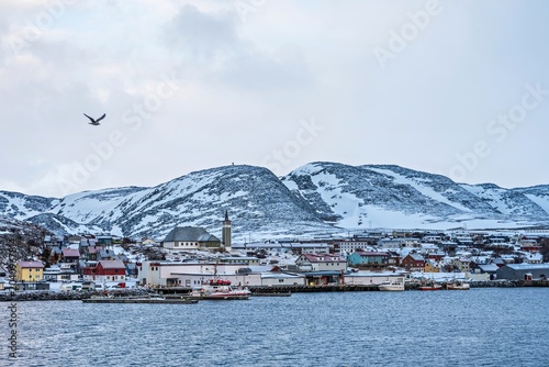 Mehamn town in Norway with church and colorful houses.