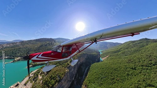 dynamic External airplane view of aircraft flying over Alpine Lake and hydroelectric dam, Provence, Southern France