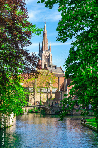 Morning view of canals and historic houses in Bruges