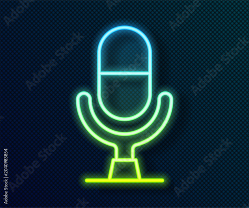 Obraz na płótnie Glowing neon line Microphone voice device icon isolated on black background