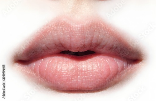 Close-up of natural human lips with soft lighting