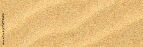 Golden sand texture with subtle ripples under warm sunlight