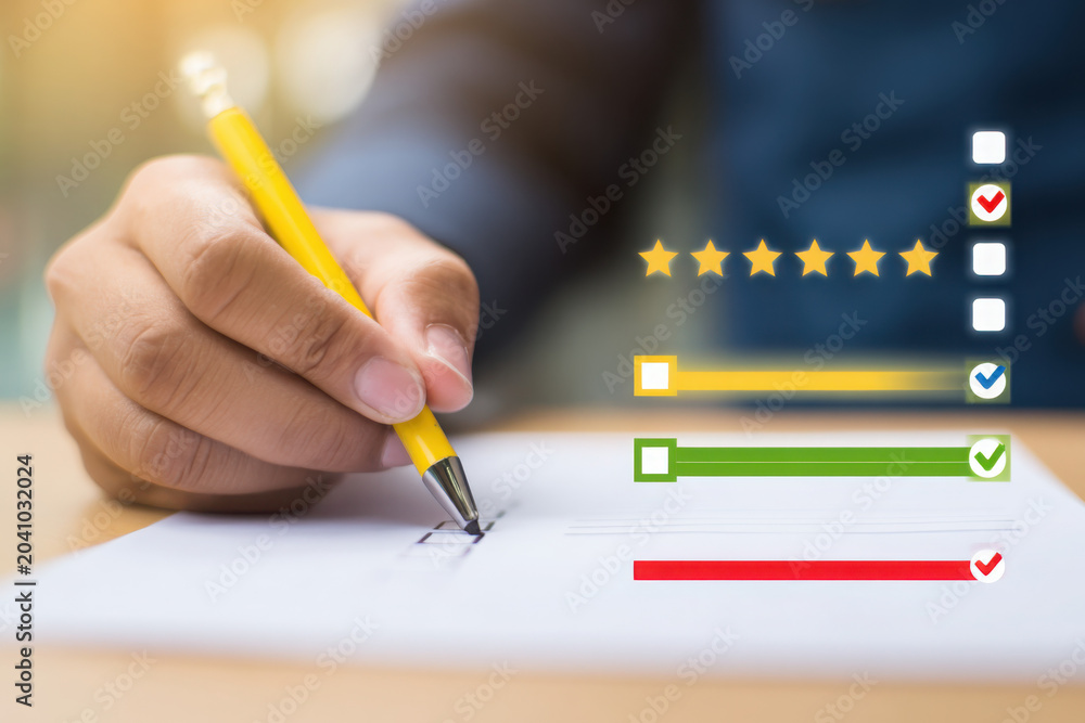 Fototapeta premium Businessman marking checklist with loading progress bar on paper
