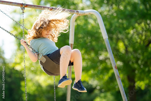 Outdoor swing scene feels dynamic. Happy outdoor play supports wellness. Outdoor recreation creates childhood adventure. Outdoor lifestyle feels cheerful and free.