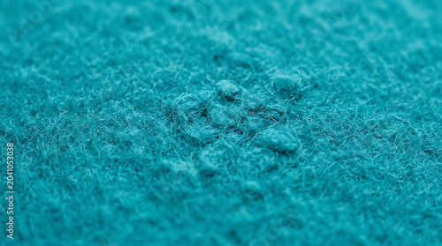 Macro Abstract View of Teal Turquoise Felt Fabric Texture Highlighting Fuzzy Wool Fibers and Soft Surface Detail for Creative Textile Backgrounds