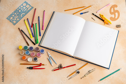 Open Blank Sketch book with Professional Drawing Tools Geometry Compasses Markers and Paints. Art Supplies