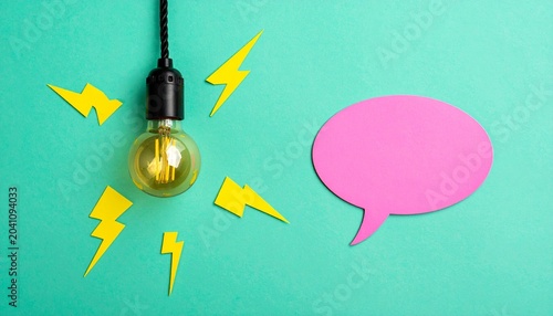 Glowing Light Bulb with Speech Bubble Representing Creativity and Communication