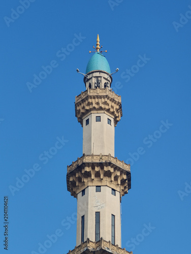 Photography Portrait of Traditional Mosque Tower Against Clear Blue Sky in Kuala Lumpur