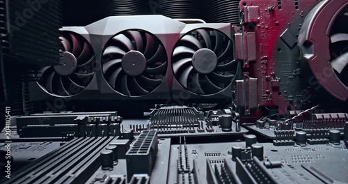 Motherboards with heatsink and fans and graphics card.