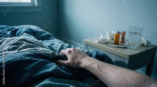 Illness And Recovery: Sick Person Touching Bed, Medicines Beside