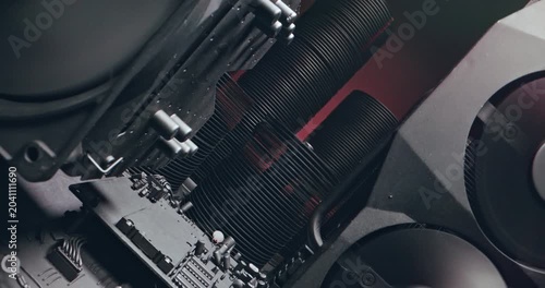 Working motherboards, fans and graphic cards. Camera move along components.