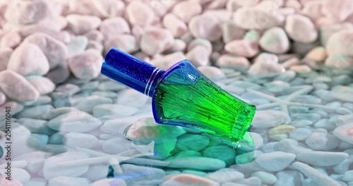 Fresh blue perfume in environment of white stones and sea. 