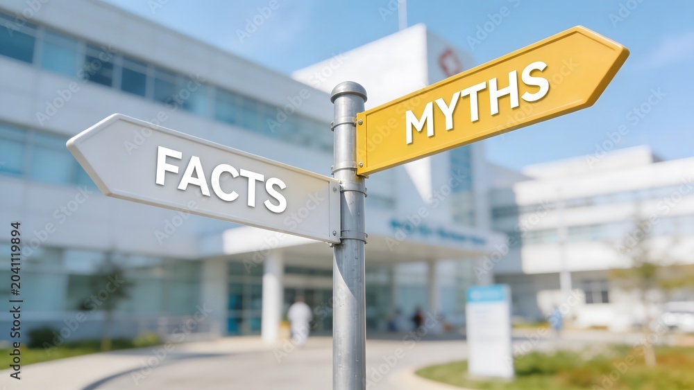 Obraz premium A conceptual directional signpost pointing towards facts and myths on a blurred modern hospital clinic background, representing medical truth, health information, and science.