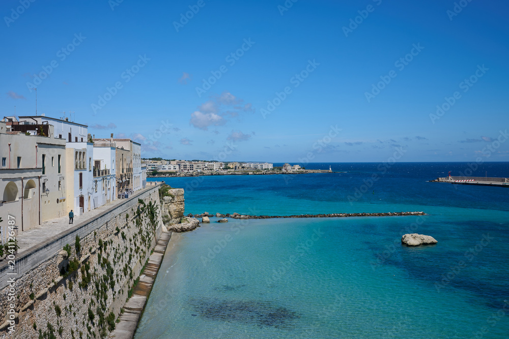 Fototapeta premium 17 May 2026 - Otranto, Italy - View of Otranto harbour / harbor and buildings overlooking sea under blue sky
