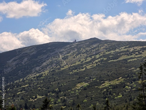 Tableau sur toile Mountain slope with hiking trail leading to distant peak in Karkonosze