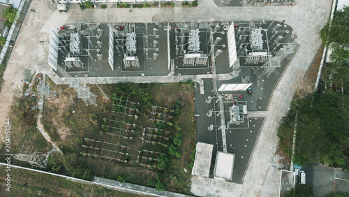 фотографія Close angled aerial of compact modern electrical substation with rows of power t