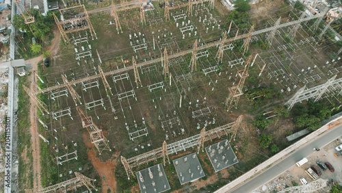 Foto Overhead aerial view of modern electrical substation with rows of power transfo