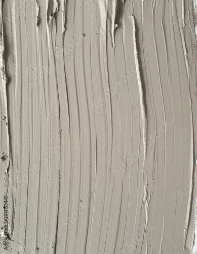 Cement adhesive spread pattern tool marks texture for installation background