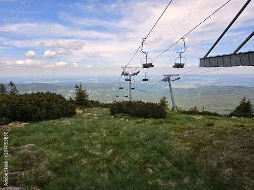 Empty Chairlift on Szrenica Mountain Overlooking Valley in Summer