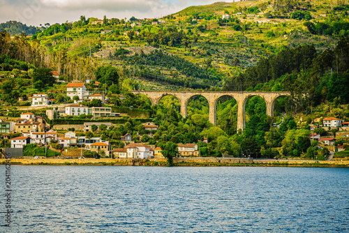 Historic Stone Railway Viaduct Above a Riverside Village in Northern Portugal
