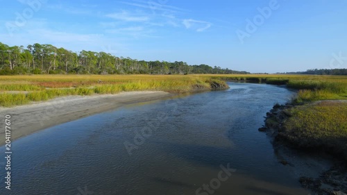 Driftwood Beach on the north end of Jekyll Island, Georgia. A tidal channel leading into a marsh